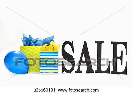 Stock Image - Sale sign with balloons and presents. Fotosearch