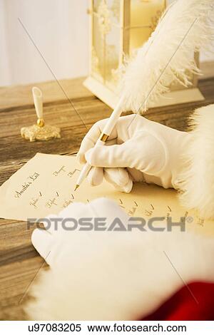 Stock Photography - Santa Claus checking to do list. Fotosearch