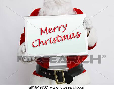 Santa Claus holding computer monitor View Large Photo Image Stock Photo - Santa Claus holding computer monitor. Fotosearch
