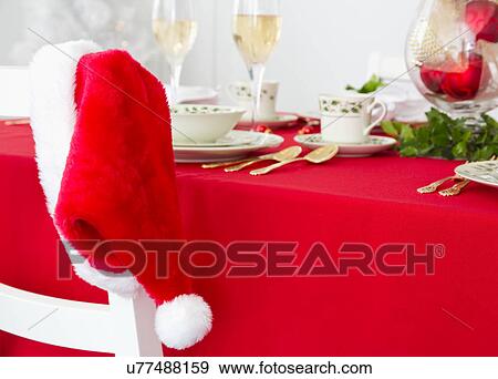 Santa hat and Christmas table View Large Photo Image Stock Photo - Santa hat and Christmas table. Fotosearch