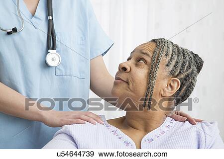 Stock Photo - Senior patient and nurse in nursing home. Fotosearch