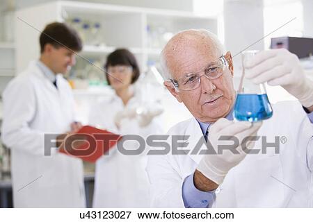 Stock Photo - Senior scientist at work. Fotosearch