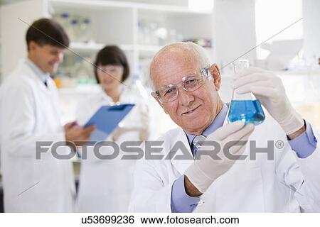 Stock Photograph - Senior scientist at work. Fotosearch