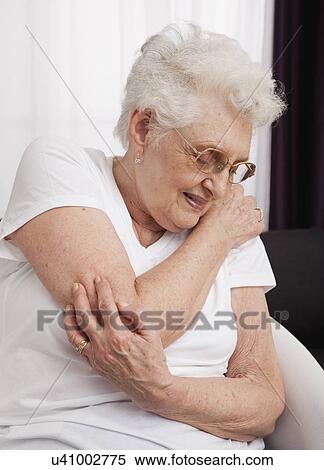 Senior woman in pain View Large Photo Image Stock Photography - Senior woman in pain. Fotosearch