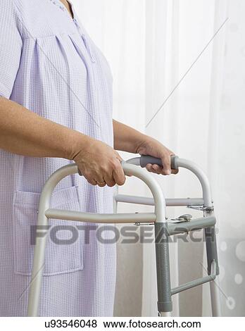 Senior woman with walker, close-up View Large Photo Image Stock Photo - Senior woman with walker, close-up. Fotosearch