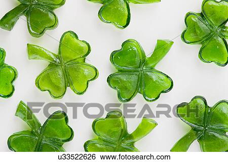Shamrock shaped St. Patrick's Day candies on white background View Large Photo Image Stock Photograph - Shamrock shaped St. Patrick's Day candies on white background. Fotosearch