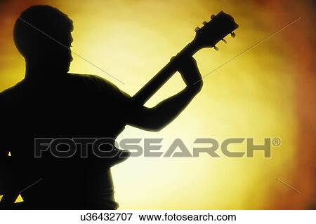 Silhouette of guitar player View Large Photo Image Stock Photo - Silhouette of guitar player. Fotosearch