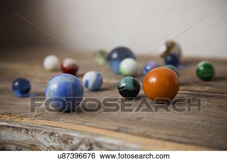 Stock Photograph - Small marble balls. Fotosearch