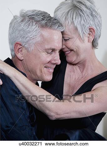 Stock Image - Smiling mature couple. Fotosearch
