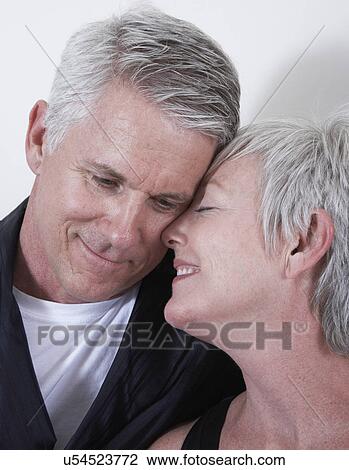 Stock Image - Smiling mature couple. Fotosearch