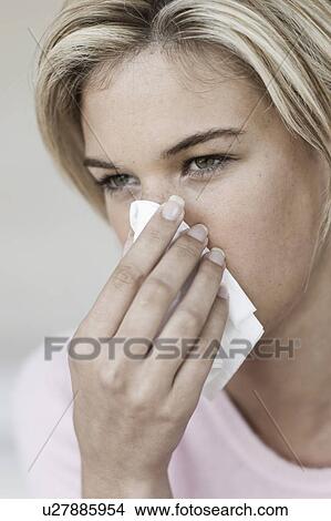 South Africa, Cape Town, Young woman blowing nose View Large Photo Image Picture - South Africa, Cape Town, Young woman blowing nose. Fotosearch