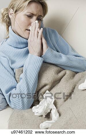 South Africa, Cape Town, Young woman blowing nose View Large Photo Image Stock Image - South Africa, Cape Town, Young woman blowing nose. Fotosearch