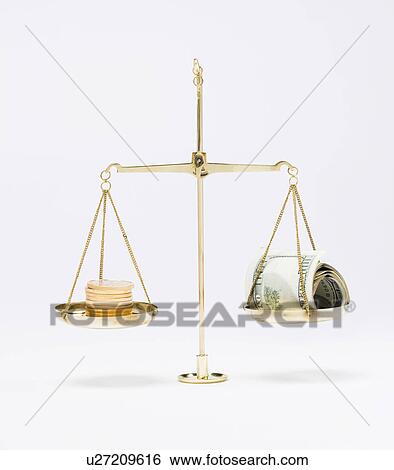 Stack of American coins and on roll of one hundred dollar bills on scale View Large Photo Image Stock Photograph - Stack of American coins and on roll of one hundred dollar bills on scale. Fotosearch