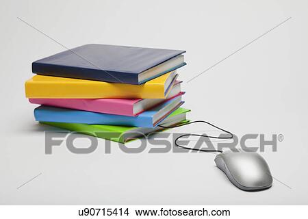 Stack of colorful books and computer mouse View Large Photo Image Picture - Stack of colorful books and computer mouse. Fotosearch