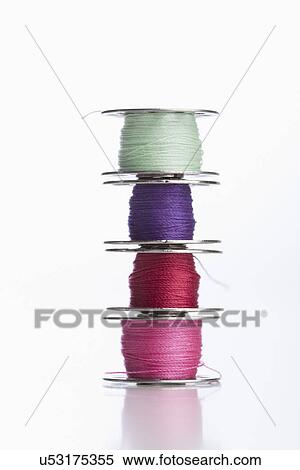 Stock Photography - Stack of multi colored threads. Fotosearch