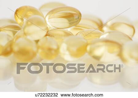 Stock Image - Stack of vitamin capsules. Fotosearch
