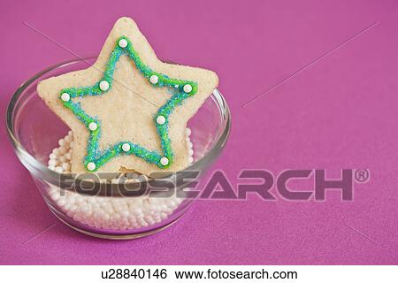 Star-shaped christmas cookie with sprinkles View Large Photo Image Stock Photograph - Star-shaped christmas cookie with sprinkles. Fotosearch