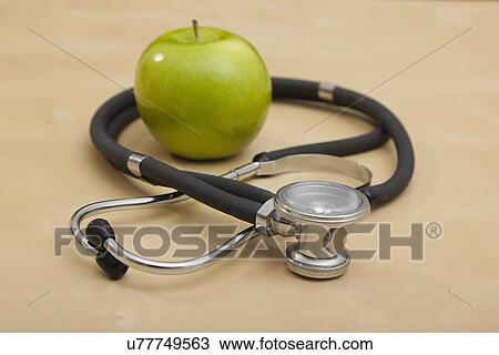 Stock Image - Stethoscope and apple. Fotosearch