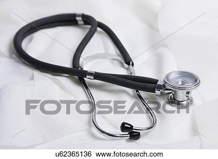 Stock Photograph - Stethoscope on white background, studio shot. Fotosearch