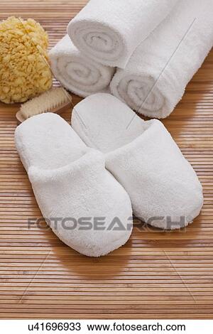 Still life with towels and slippers View Large Photo Image Stock Image - Still life with towels and slippers. Fotosearch