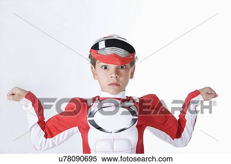 Studio portrait of boy (10-11) wearing super hero costume View Large Photo Image Stock Photography - Studio portrait of boy (10-11) wearing super hero costume. Fotosearch