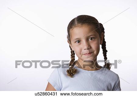 Stock Image - Studio portrait of girl (8-9). Fotosearch