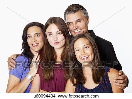 Studio portrait of parents with two daughters (12-13, 14-15) View Large Photo Image Picture - Studio portrait of parents with two daughters (12-13, 14-15). Fotosearch