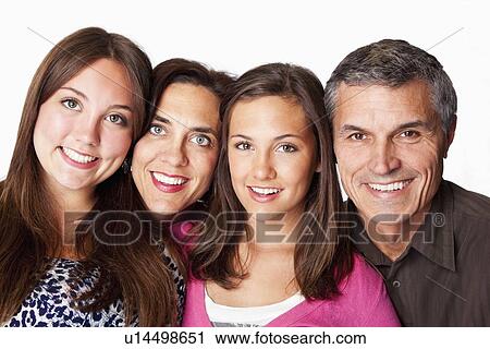Studio portrait of parents with two daughters (12-13, 14-15) View Large Photo Image Stock Image - Studio portrait of parents with two daughters (12-13, 14-15). Fotosearch