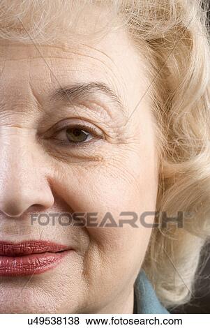 Stock Photo - Studio portrait of senior woman. Fotosearch