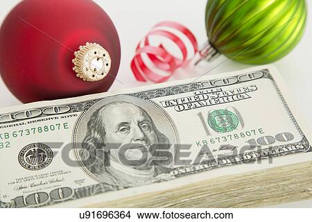 Studio shot of banknotes and Christmas ornaments View Large Photo Image Picture - Studio shot of banknotes and Christmas ornaments. Fotosearch