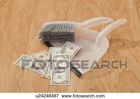 Studio shot of banknotes on dust pan View Large Photo Image Stock Photo - Studio shot of banknotes on dust pan. Fotosearch