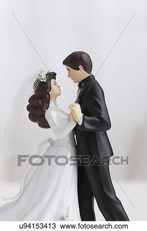 Studio shot of bride and groom figurines dancing View Large Photo Image Stock Image - Studio shot of bride and groom figurines dancing. Fotosearch