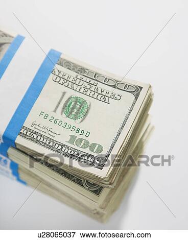 Stock Photo - Studio shot of bunch of one hundred dollar banknotes. Fotosearch