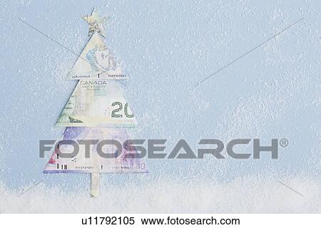 Stock Photography - Studio shot of Christmas tree produced of Canadian currency. Fotosearch