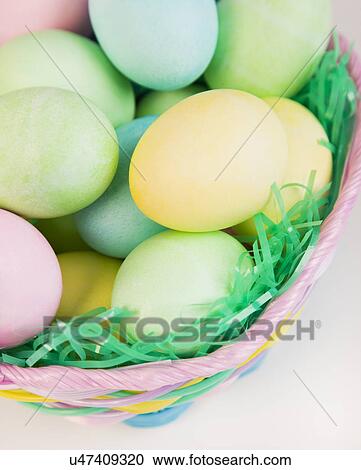 Studio shot of Easter eggs in basket View Large Photo Image Stock Image - Studio shot of Easter eggs in basket. Fotosearch
