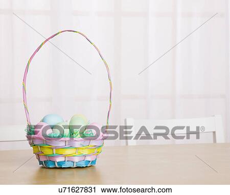 Studio shot of Easter eggs in basket View Large Photo Image Stock Image - Studio shot of Easter eggs in basket. Fotosearch