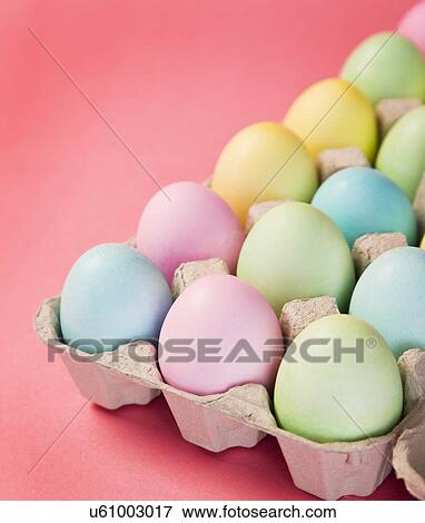 Stock Photo - Studio shot of Easter eggs in carton box. Fotosearch