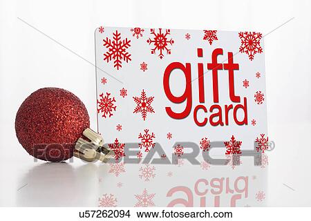 Studio shot of gift card and Christmas ornament View Large Photo Image Picture - Studio shot of gift card and Christmas ornament. Fotosearch