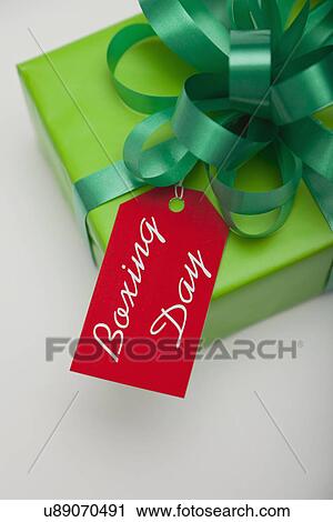 Stock Image - Studio shot of gift with Black Friday tag. Fotosearch