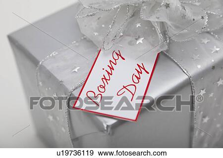 Stock Photo - Studio shot of gift with Boxing Day tag. Fotosearch