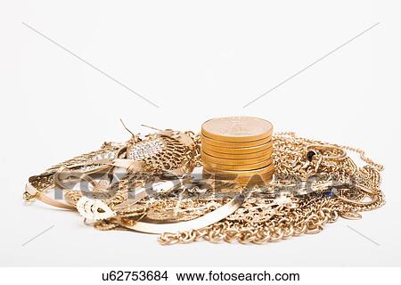 Picture - Studio shot of gold jewelry and coins. Fotosearch