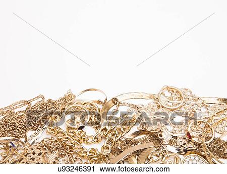 Stock Image - Studio shot of gold jewelry. Fotosearch
