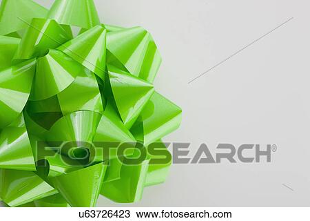 Studio shot of green gift bow View Large Photo Image Stock Image - Studio shot of green gift bow. Fotosearch