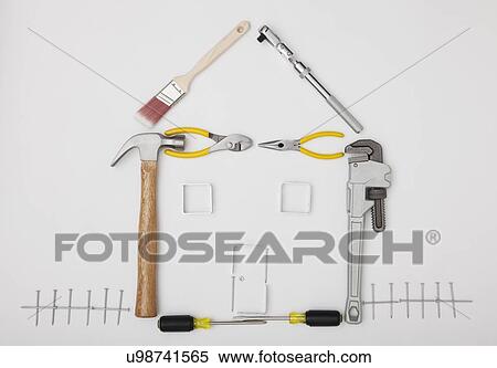 Studio shot of hand tools in house shape View Large Photo Image Stock Photography - Studio shot of hand tools in house shape. Fotosearch