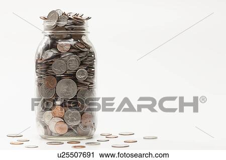 Studio shot of jar full of coins View Large Photo Image Stock Image - Studio shot of jar full of coins. Fotosearch