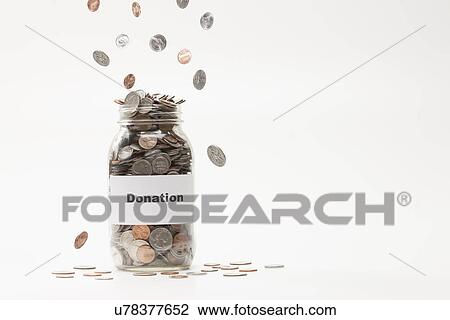 Studio shot of jar full of coins View Large Photo Image Stock Image - Studio shot of jar full of coins. Fotosearch