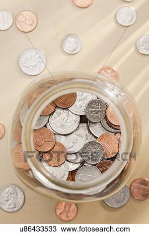 Studio shot of jar with coins View Large Photo Image Stock Image - Studio shot of jar with coins. Fotosearch