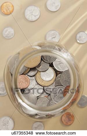 Studio shot of jar with coins View Large Photo Image Stock Photo - Studio shot of jar with coins. Fotosearch
