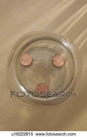 Stock Photography - Studio shot of jar with coins. Fotosearch