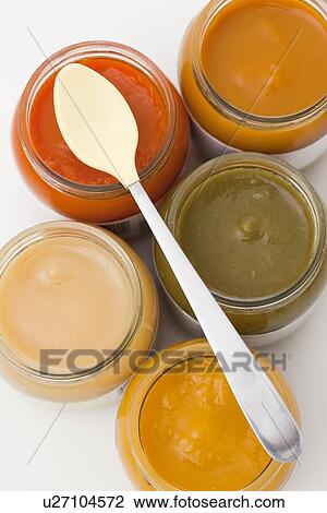 Stock Image - Studio shot of jars with baby food. Fotosearch
